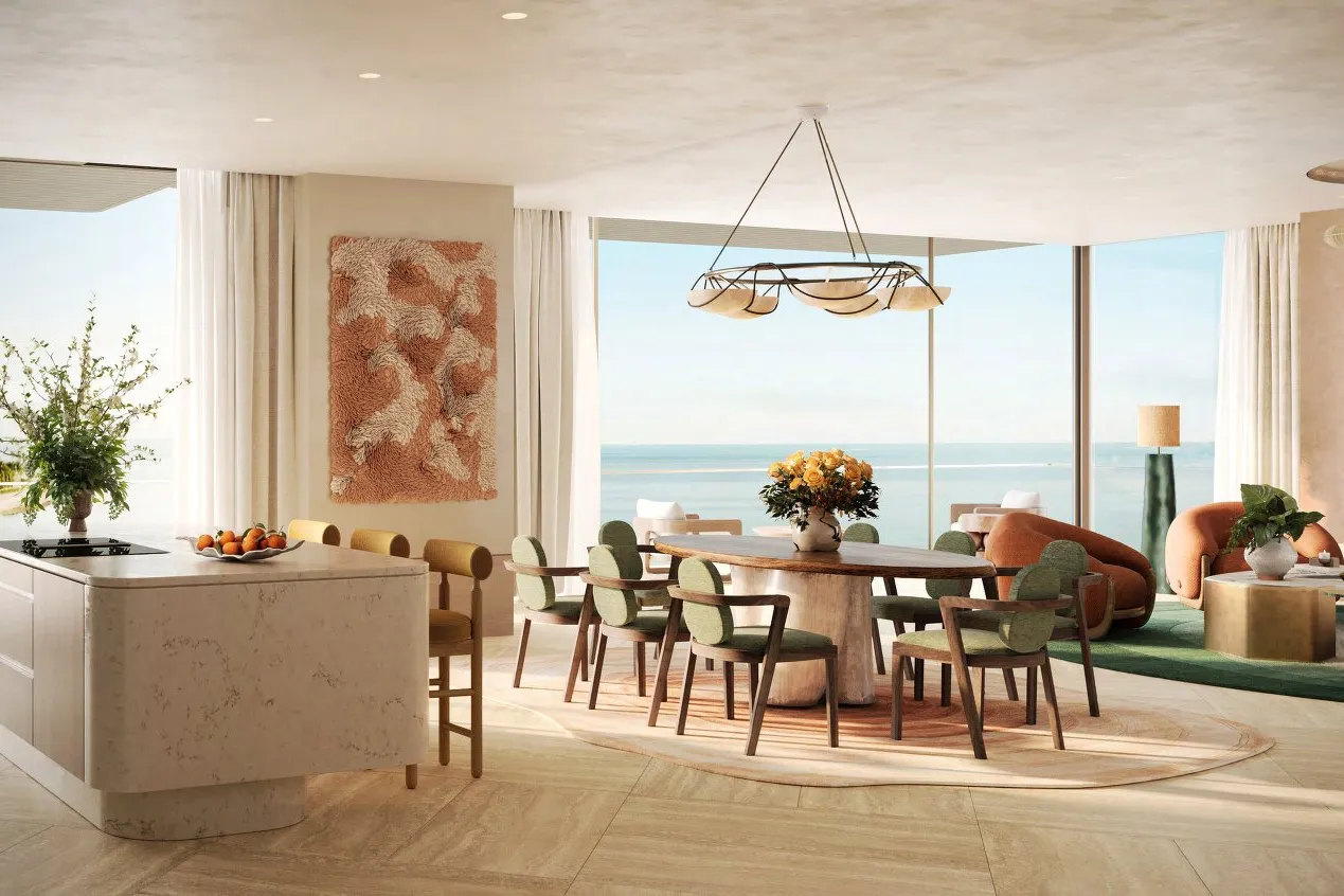 Open kitchen island and dining table facing wide sea views